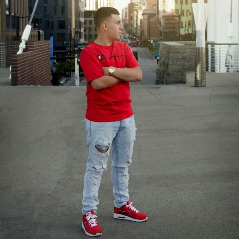 Client showing off a fresh short fade haircut outdoors