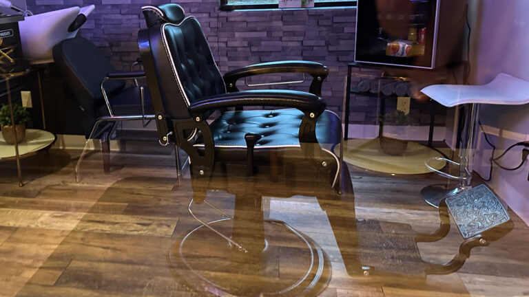 Leather barber chair and shampoo bowl inside Joni's private suite in Lone Tree